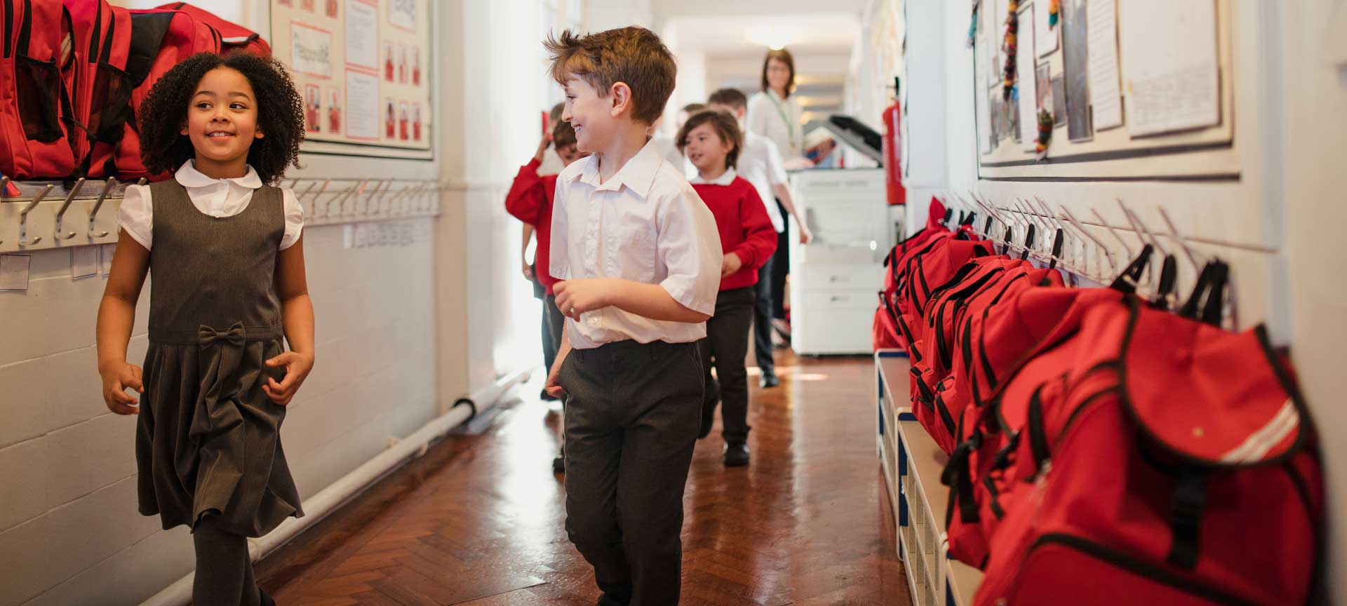 Children walking down a school corridor