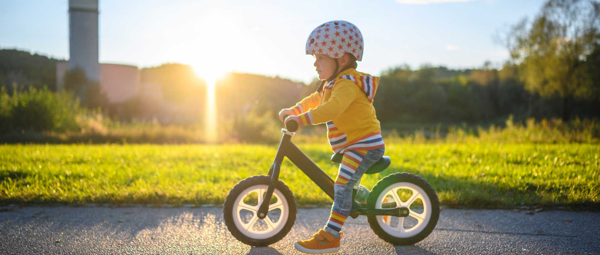 A young child on a balance bike