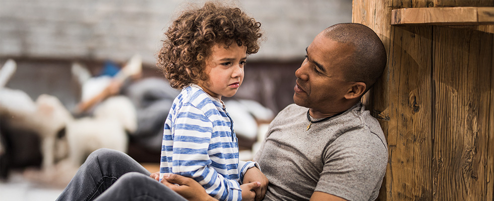 Father helping children navigate their emotions