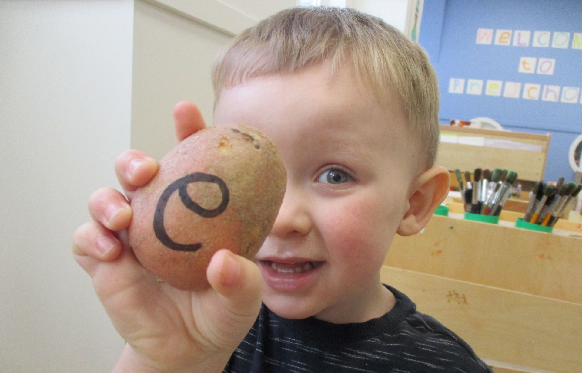 Epsom nursery children use potatoes to make words