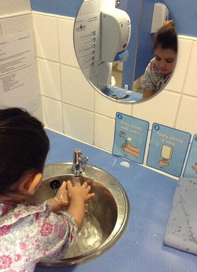 Chelsea nursery children practice washing their hands