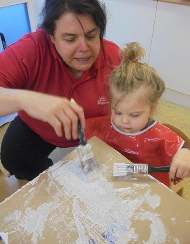 Leeds nursery children build cardboard snowman