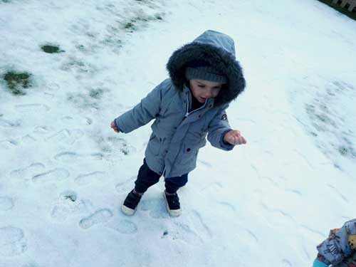 Astley nursery children embrace playing in the snow