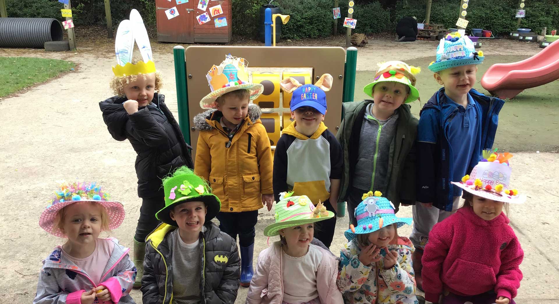 A group of children posing with their Easter bonnets on