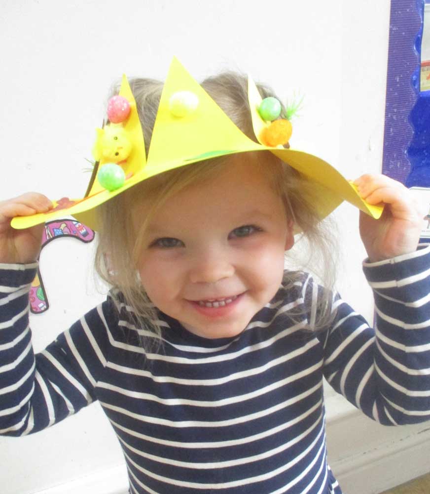 A young child wearing her Easter bonnet