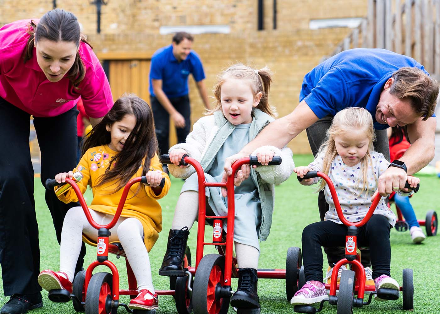 Preschoolers Playing Outside on Bikes