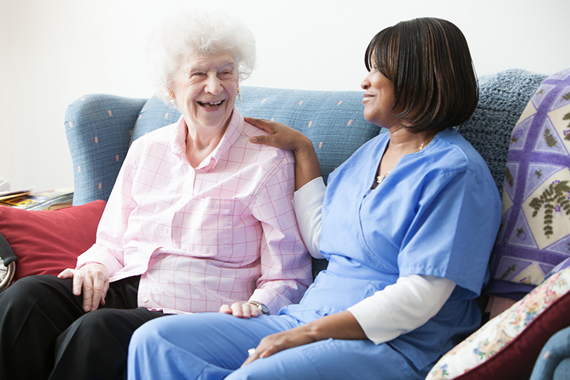 elderly lady at care home with nurse