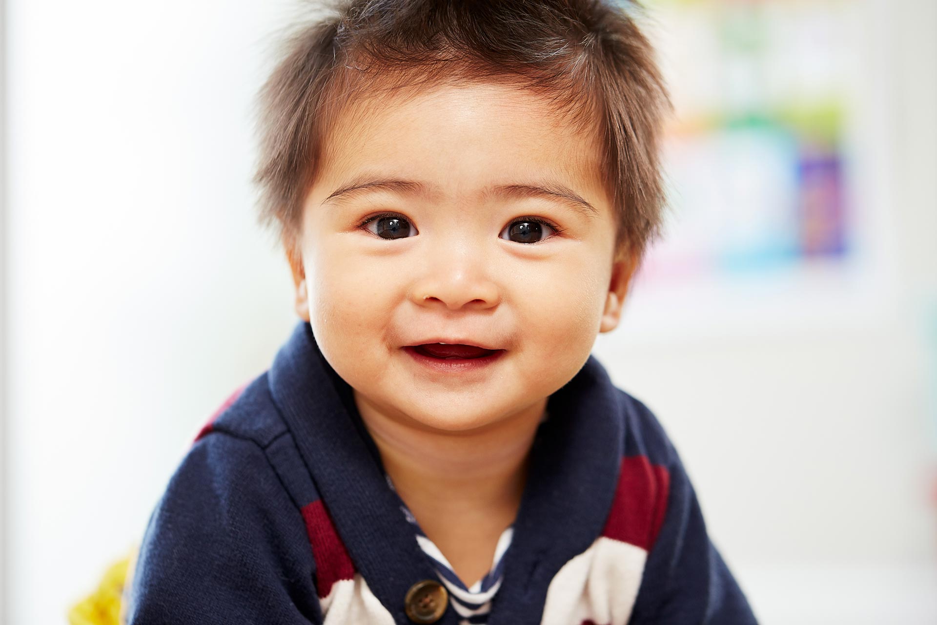 A toddler smiling