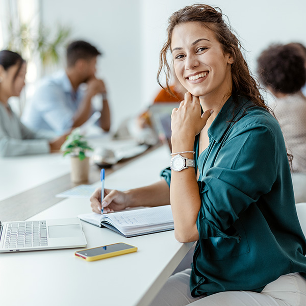 Why Pet Care, Manager Sat at Desk