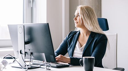 Business women working and reflecting at work